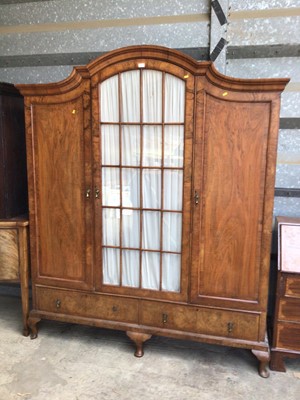 Lot 4 - Good quality early 20th century walnut dome top triple wardrobe with central glazed door flanked by two panelled doors, with two drawers below on cabriole feet, 179cm wide, 50cm deep, 210cm high