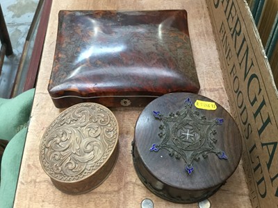 Lot 500 - Victorian tortoiseshell box with velvet interior, on four bun feet with white metal escutcheon, together with a carved box, possibly birch, and a filigree and enamel mounted box (3)