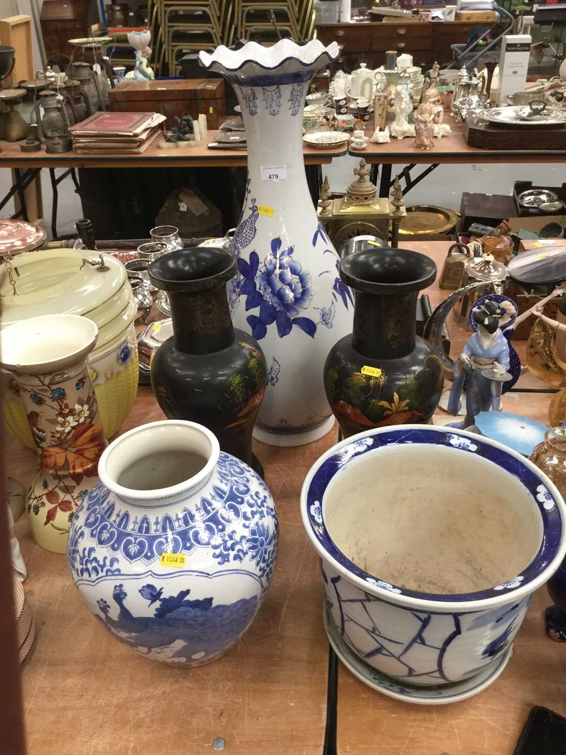 Lot 479 - Large blue and white Japanese vase, another vase, a blue and white jardinière and stand, and a pair of lacquered vases