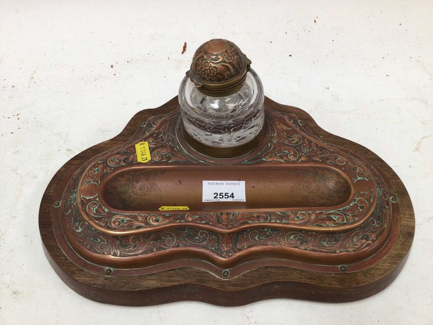 Lot 2554 - Art nouveau copper inkstand on wooden base