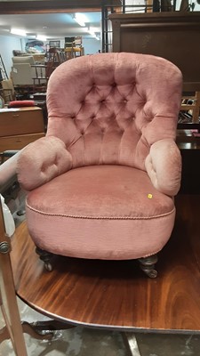 Lot 1193 - Two Victorian armchairs with buttoned pink upholstery on turned front legs