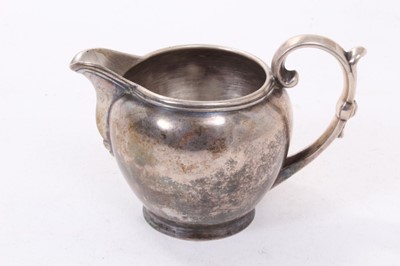 Lot 382 - 19th century Anglo Indian silver milk jug with scroll handle and pseudo British hallmarks to base, 3oz, 8cm in height.
