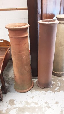 Lot 1198 - Two large Victorian terracotta chimney pots, 118.5cm high and 116.5cm high