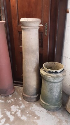 Lot 1199 - Three Victorian terracotta chimney pots, 123cm high, 65cm high and 61cm high