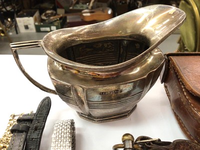 Lot 917 - Silver milk jug, pocket watch, compass in leather case, three wristwatches and a sword paper knife