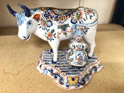 Lot 353 - Dutch Delft model of a cow and milkmaid
