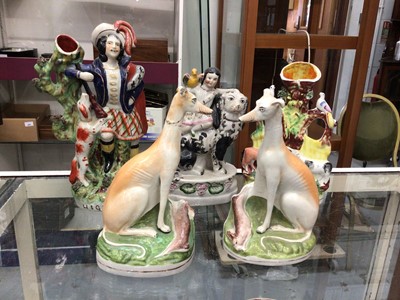Lot 271 - Pair of Victorian Staffordshire greyhounds, together with three other Staffordshire figures