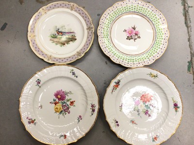 Lot 361 - Pair of Royal Copenhagen plates painting with flowers and two 19th century cabinet plates, one painted with an exotic bird (4)