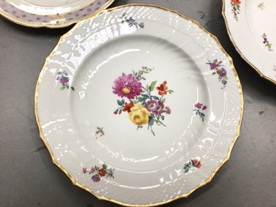 Lot 361 - Pair of Royal Copenhagen plates painting with flowers and two 19th century cabinet plates, one painted with an exotic bird (4)