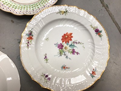 Lot 361 - Pair of Royal Copenhagen plates painting with flowers and two 19th century cabinet plates, one painted with an exotic bird (4)