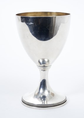 Lot 232 - George III silver goblet / chalice of conventional form with gilded interior and raised on circular pedestal foot with beaded border, (London 1775), maker I.C. all at 8.5ozs, 15.5cm in overall height.