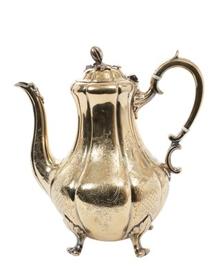 Lot 389 - Victorian silver gilt coffee pot of baluster form with engraved foliate and scroll decoration