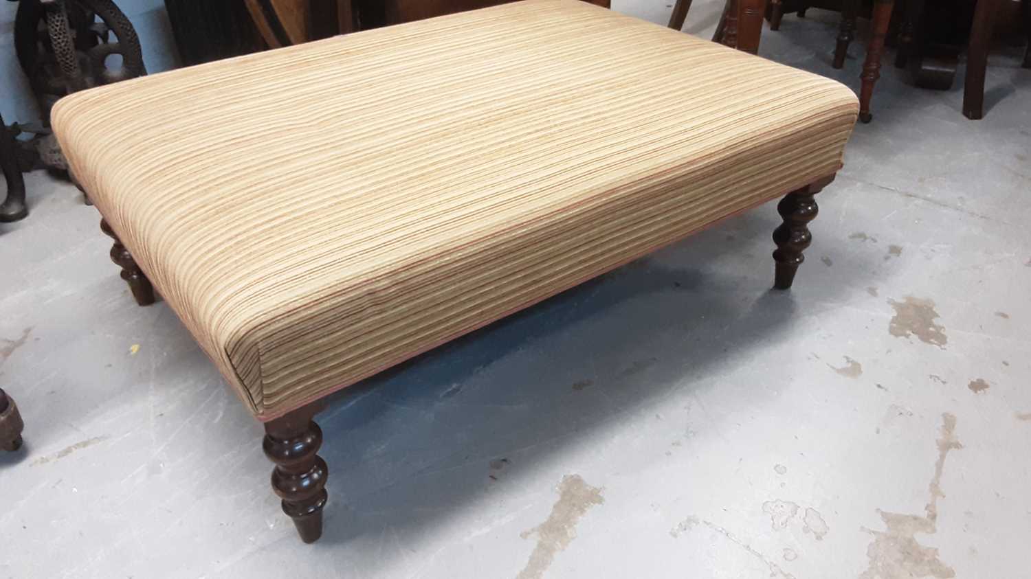 Lot 1240 - Large contemporary footstool with striped upholstery on turned legs, 103cm x 77cm