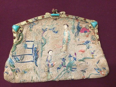 Lot 2120 - Oriental silk purse with ornate frame