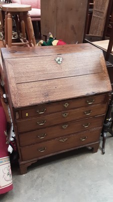 Lot 1253 - George III oak bureau with fitted interior including well, four long graduated drawers below with brass handles on bracket feet, 86cm wide, 50cm deep, 108.5cm high