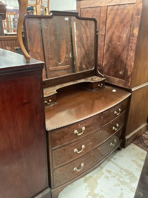 Lot 1261 - Good quality Edwardian mahogany bow front triple wardrobe with matching dressing chest (2)