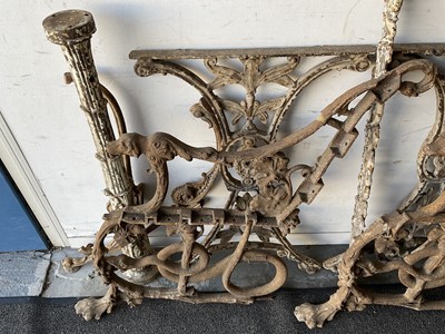 Lot 1262 - Pair of cast iron bench ends, together with pair of cast iron table ends and various other cast iron furniture elements