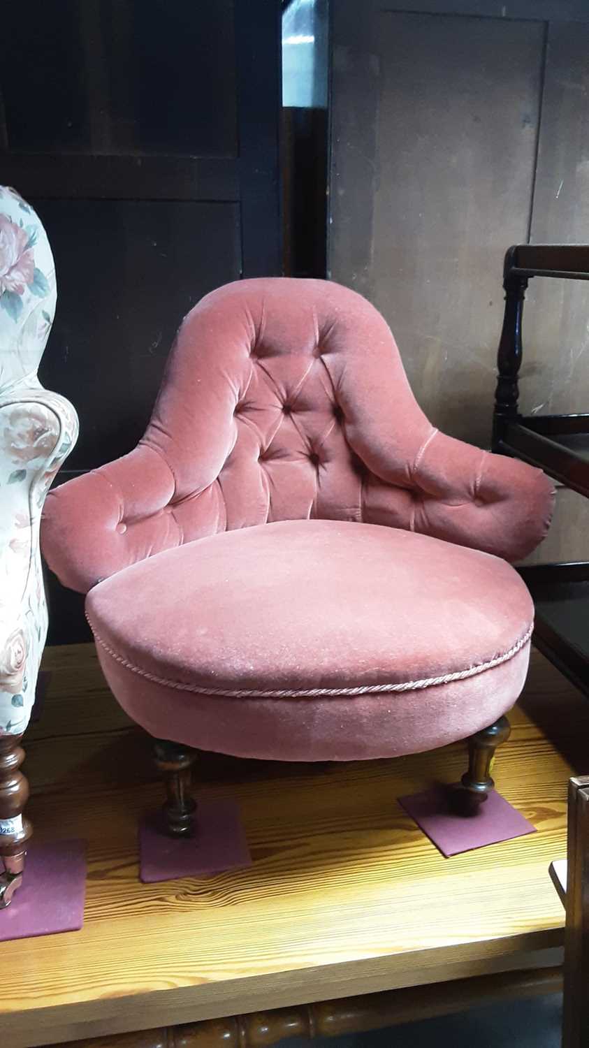 Lot 1269 - Victorian chair with shaped back and buttoned pink upholstery on turned front legs