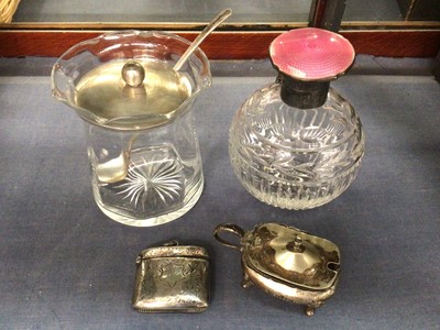 Lot 961 - Silver and pink enamel topped glass perfume bottle, silver topped glass preserve pot with silver spoon, silver vesta case and silver condiment