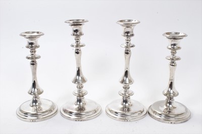 Lot 378 - Two pairs of similar Victorian silver plated candlesticks with removable sconces and fluted columns on circular bases, makers marks for Elkington & Co. Each 22cm in height. (4)