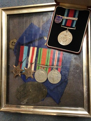 Lot 381 - WWII medals in glazed frame, Normandy Campaign medal in original case and Normandy enamelled pin