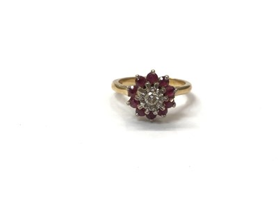 Lot 977 - 18ct gold diamond and ruby flower head cluster ring, size M