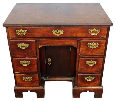 Lot 1341 - George II mahogany kneehole desk