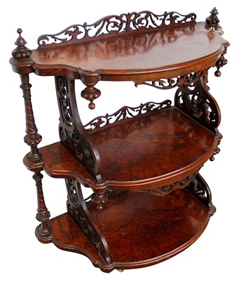 Lot 1329 - Victorian burr walnut three tier what not of shaped form with pierced fretwork supports