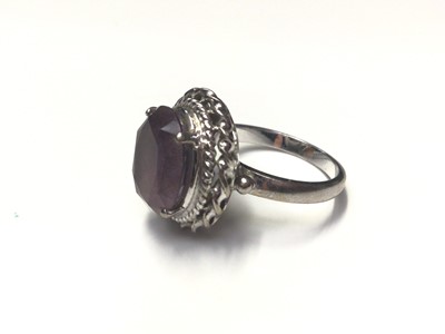 Lot 29 - White gold (stamped 585) purple stone cocktail ring
