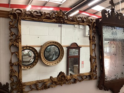 Lot 1457 - Rococo revival wall mirror, with arched rectangular plate in scrolling surround, 87 x 72cm