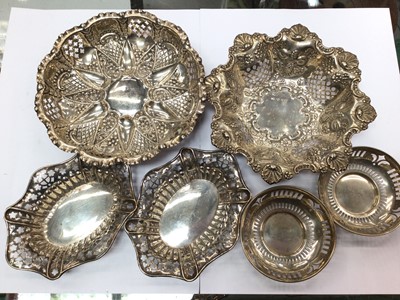 Lot 993 - Pair of silver bon bon dishes, pair of small circular silver dishes and two other silver dishes, all with pierced decoration (6)