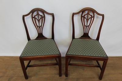 Lot 1333 - Pair of George III shield back chairs standing on tapered legs