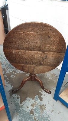 Lot 1331 - Antique oak tilt top table on turned column and three hipped splayed legs