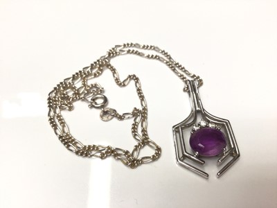 Lot 43 - 18ct white gold diamond and amethyst pendant on a silver chain.