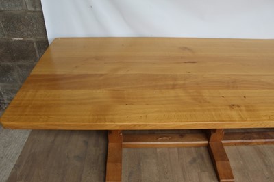 Lot 1309 - Rare Derek Slater 'lizard-man' oak refectory table, with associated plank top on facetted trestle supports united by foot stretchers, with signature lizard carved to base