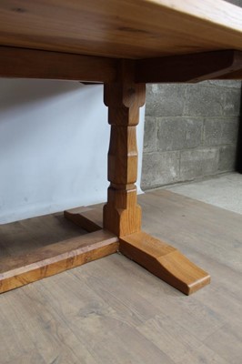 Lot 1309 - Rare Derek Slater 'lizard-man' oak refectory table, with associated plank top on facetted trestle supports united by foot stretchers, with signature lizard carved to base