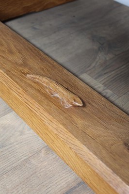 Lot 1309 - Rare Derek Slater 'lizard-man' oak refectory table, with associated plank top on facetted trestle supports united by foot stretchers, with signature lizard carved to base