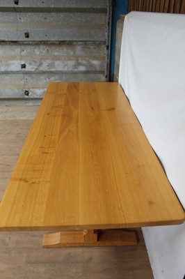 Lot 1309 - Rare Derek Slater 'lizard-man' oak refectory table, with associated plank top on facetted trestle supports united by foot stretchers, with signature lizard carved to base