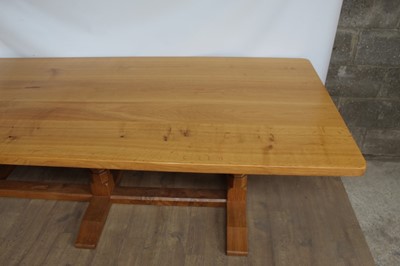 Lot 1309 - Rare Derek Slater 'lizard-man' oak refectory table, with associated plank top on facetted trestle supports united by foot stretchers, with signature lizard carved to base