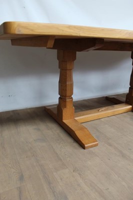 Lot 1309 - Rare Derek Slater 'lizard-man' oak refectory table, with associated plank top on facetted trestle supports united by foot stretchers, with signature lizard carved to base