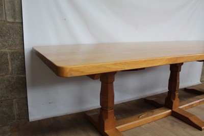 Lot 1309 - Rare Derek Slater 'lizard-man' oak refectory table, with associated plank top on facetted trestle supports united by foot stretchers, with signature lizard carved to base