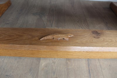 Lot 1309 - Rare Derek Slater 'lizard-man' oak refectory table, with associated plank top on facetted trestle supports united by foot stretchers, with signature lizard carved to base