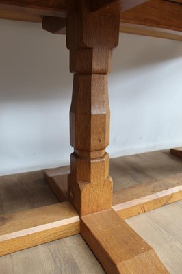 Lot 1309 - Rare Derek Slater 'lizard-man' oak refectory table, with associated plank top on facetted trestle supports united by foot stretchers, with signature lizard carved to base