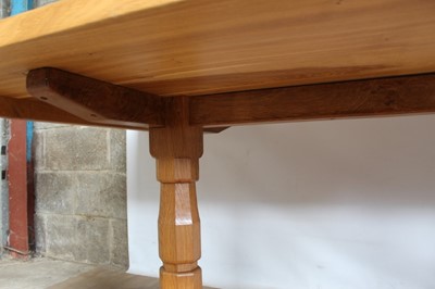 Lot 1309 - Rare Derek Slater 'lizard-man' oak refectory table, with associated plank top on facetted trestle supports united by foot stretchers, with signature lizard carved to base