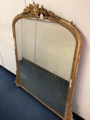 Lot 1353 - Victorian gilt gesso overmantel mirror, of arched form with pierced cartouche cresting, 134cm wide x 158cm high