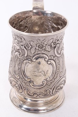 Lot 370 - George III silver tankard of baluster form with scroll handle and later chased floral and scroll decoration and cartouche with engraved armorial (Newcastle 1774) Maker John Langlands I. All at appr...
