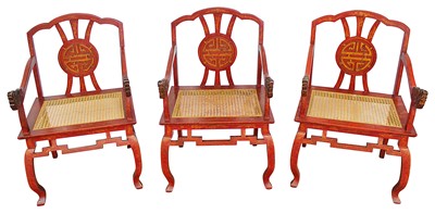 Lot 1381 - Set of three Chinese red lacquered dragon chairs