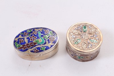 Lot 392 - Ronson Varaflame lighter with overlaid silver cover, marked Alex and Co, Sterling, together with an oval white metal and enamel pill box and a similar circular one (apparently unmarked) (3).
