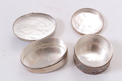 Lot 392 - Ronson Varaflame lighter with overlaid silver cover, marked Alex and Co, Sterling, together with an oval white metal and enamel pill box and a similar circular one (apparently unmarked) (3).