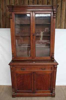 Lot 1423 - Late Victorian mahogany two height bookcase with shelved interior enclosed by two glazed doors with single drawer and cupboards below, 108cm wide x 46cm deep x 208cm high